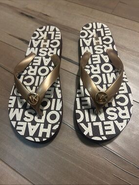 Michael Kors Gold Strap Flip Flops with Brown and White Logo Footbed